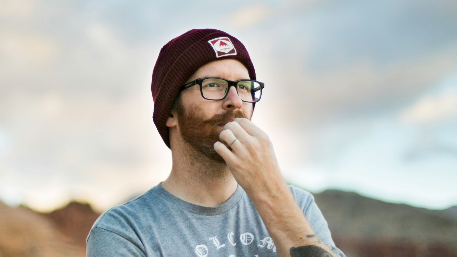 woman in blue crew neck t-shirt wearing black sunglasses