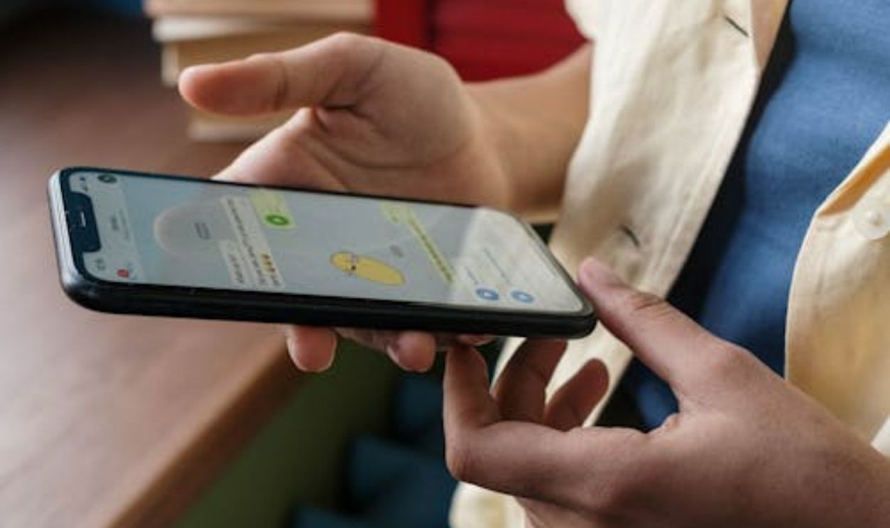 Person texting on iphone