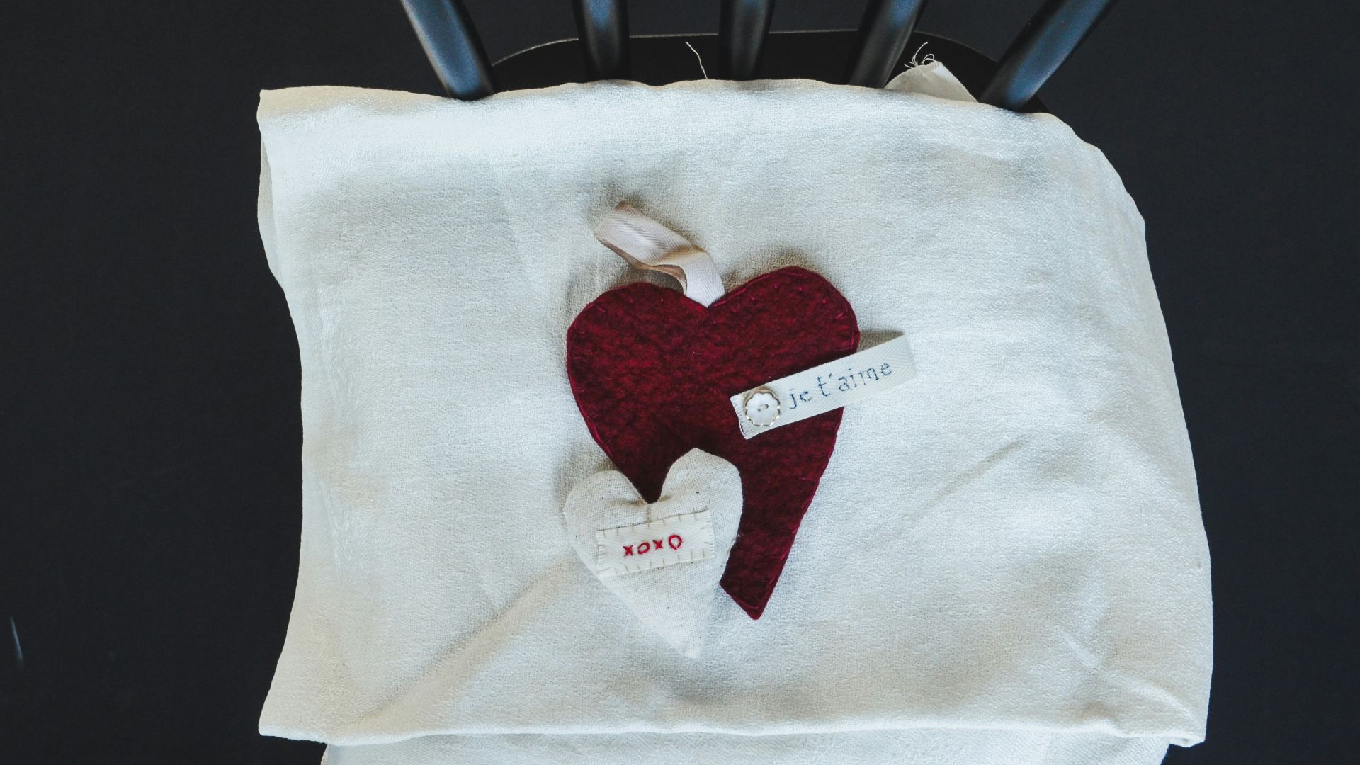 a red heart is on a white towel