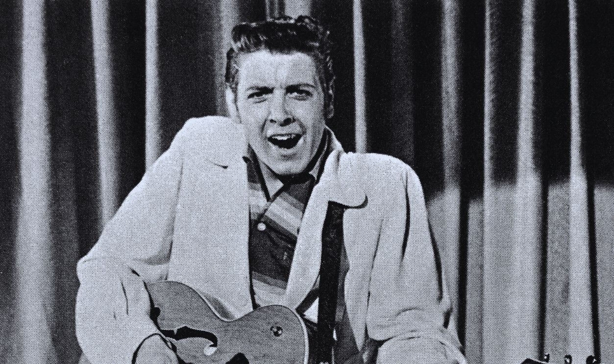 Gettyimages  - 515354766, Rock Star Eddie Cochran (Original Caption) Eddie Cochran, rock star, singing with electric guitar. 