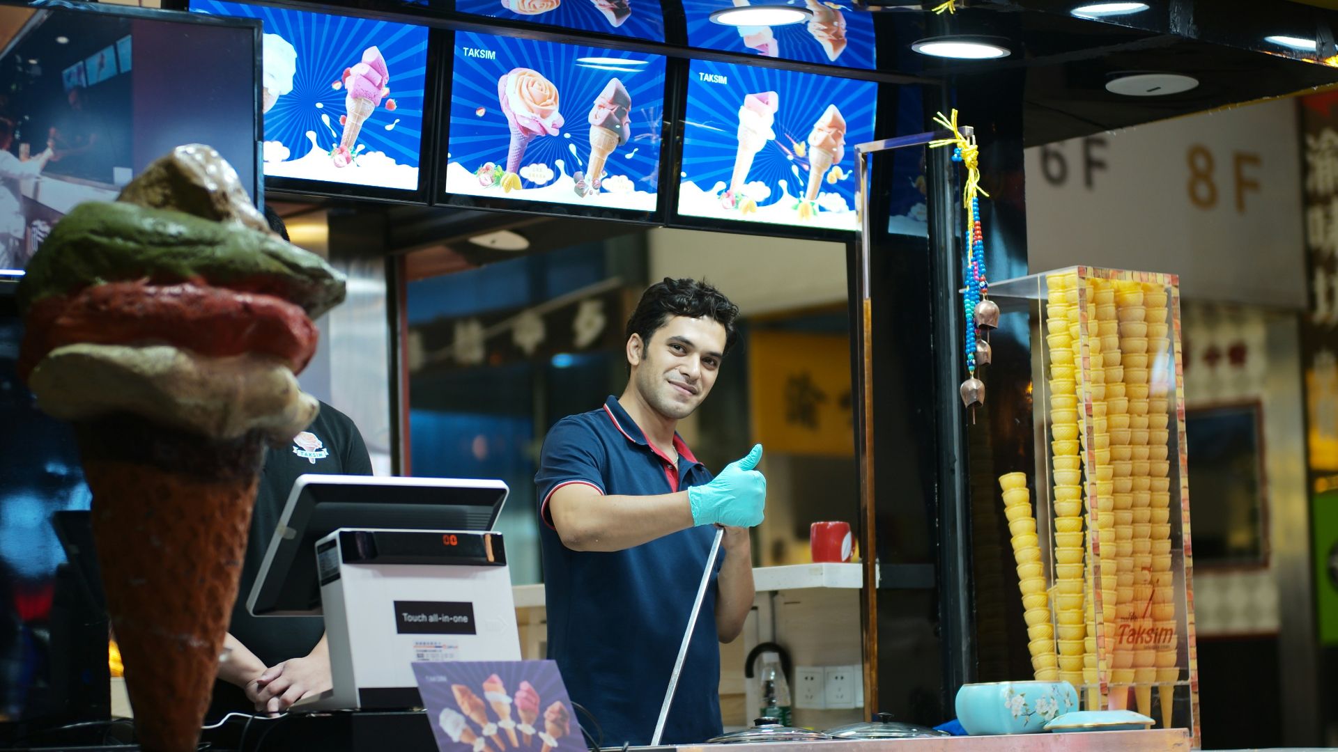 Man preparing ice cream at a street stall.