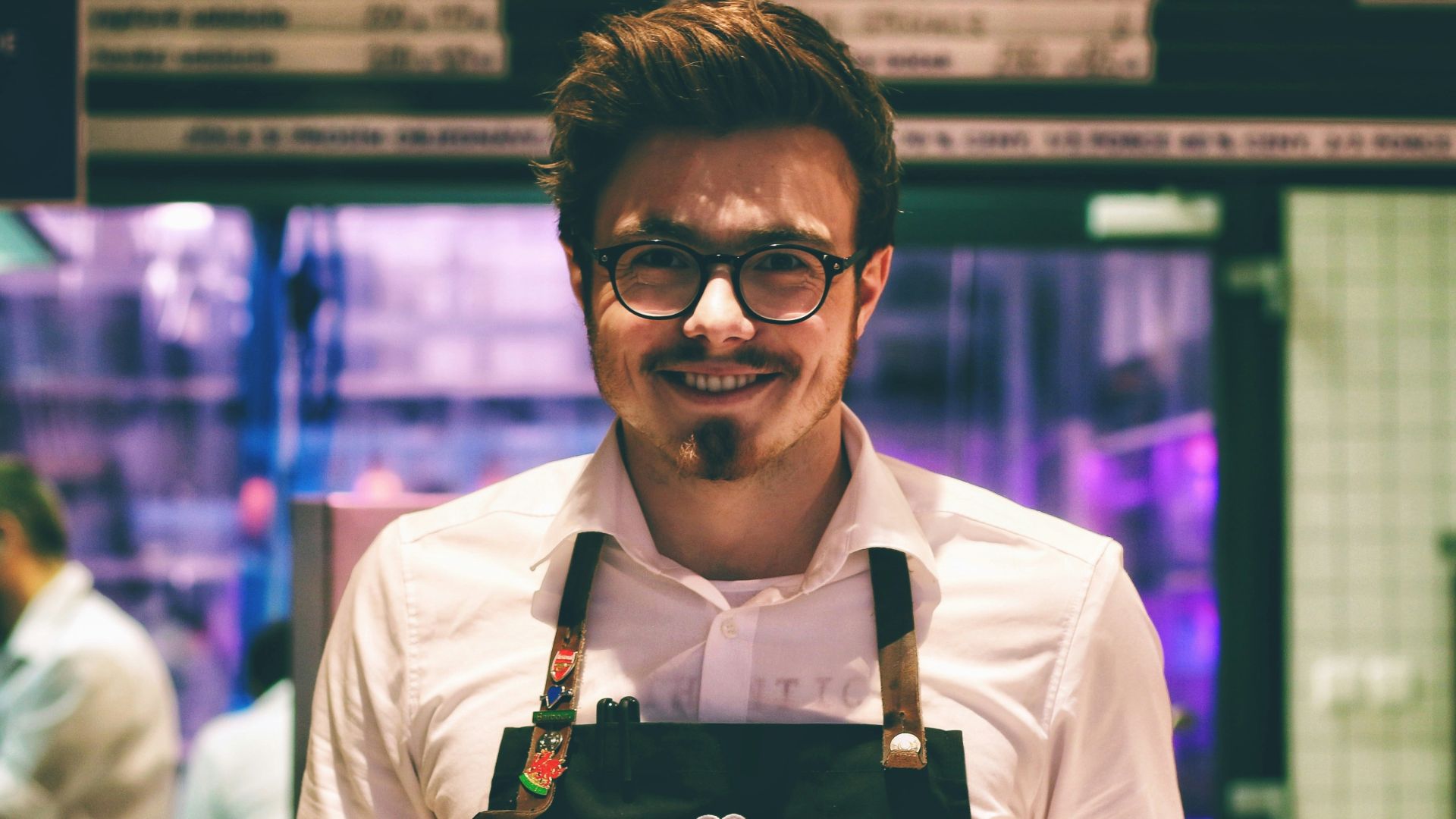 man holding fish dish on plate