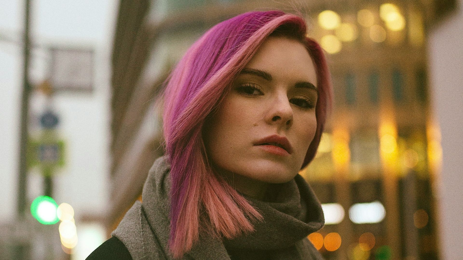 woman in black coat and pink hijab