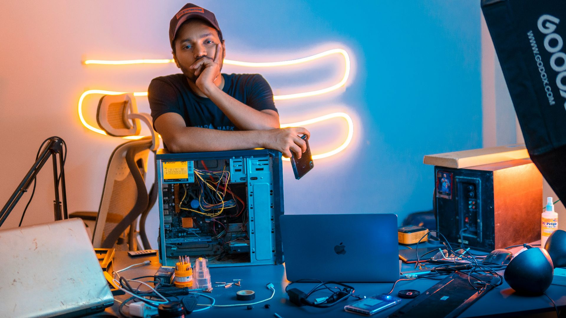 A man sitting in front of a laptop computer