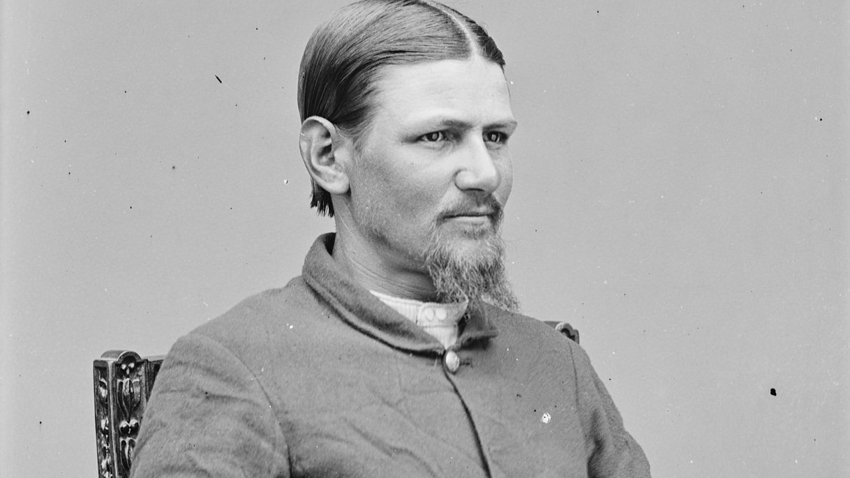 Sgt. Boston Corbett portrait sitting on a chair