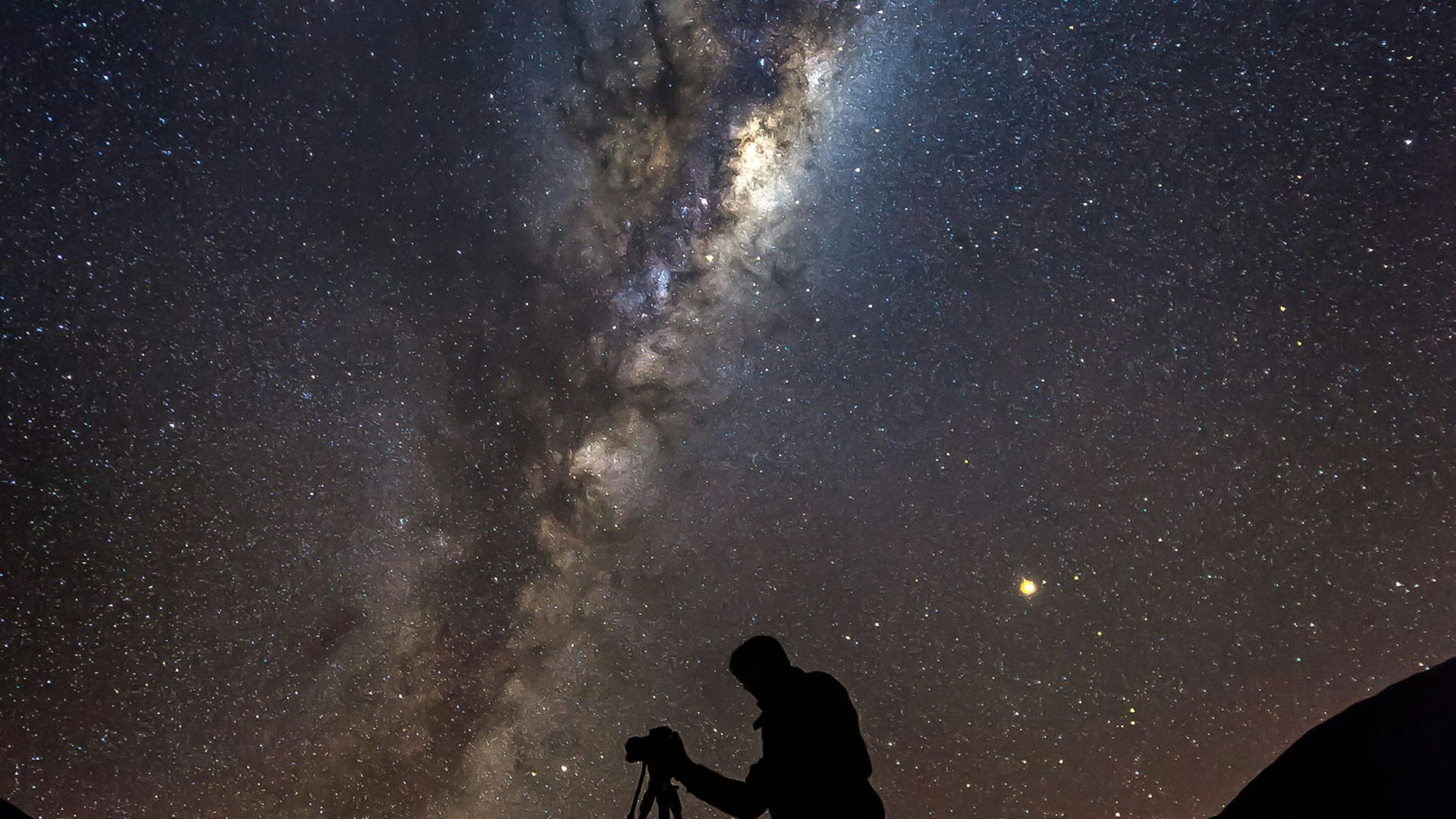 silhouette photo of man under Aurora phenomenon