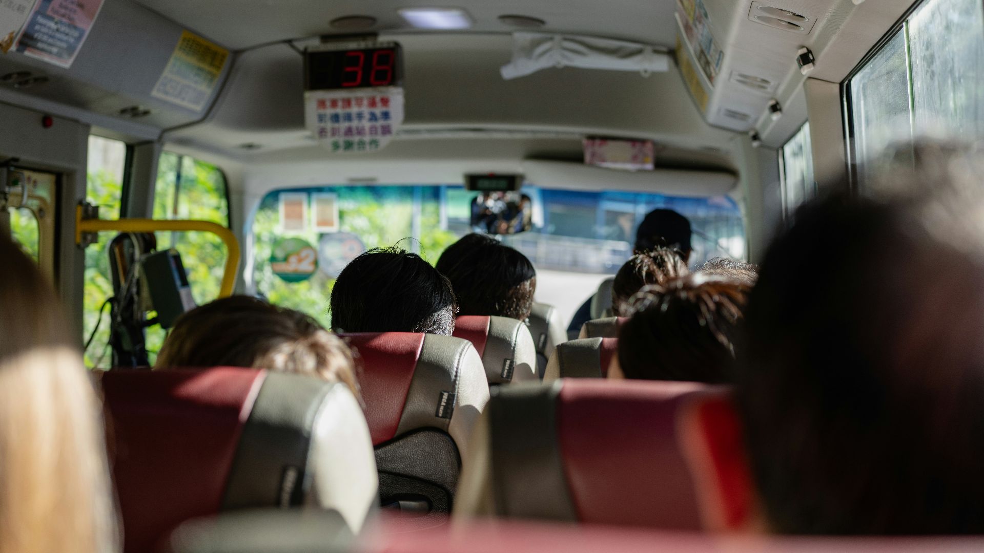 a group of people sitting on a bus
