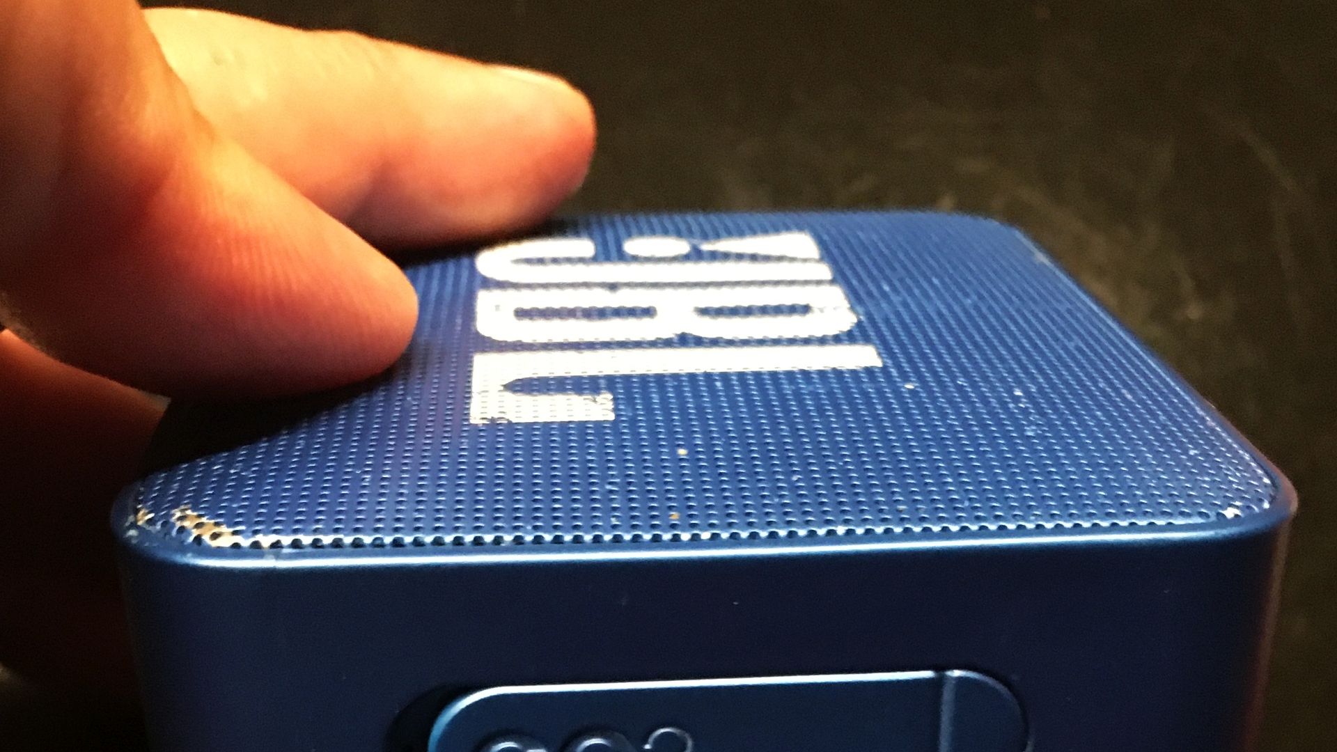 File:JBL GO2 Bluetooth speaker with ports covered under hatch.jpg