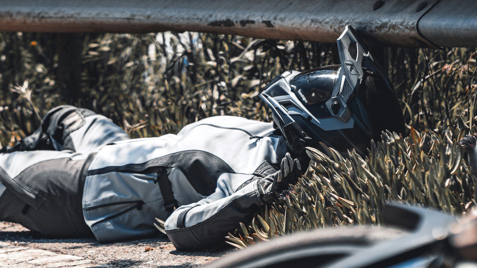 a person lying on a bench