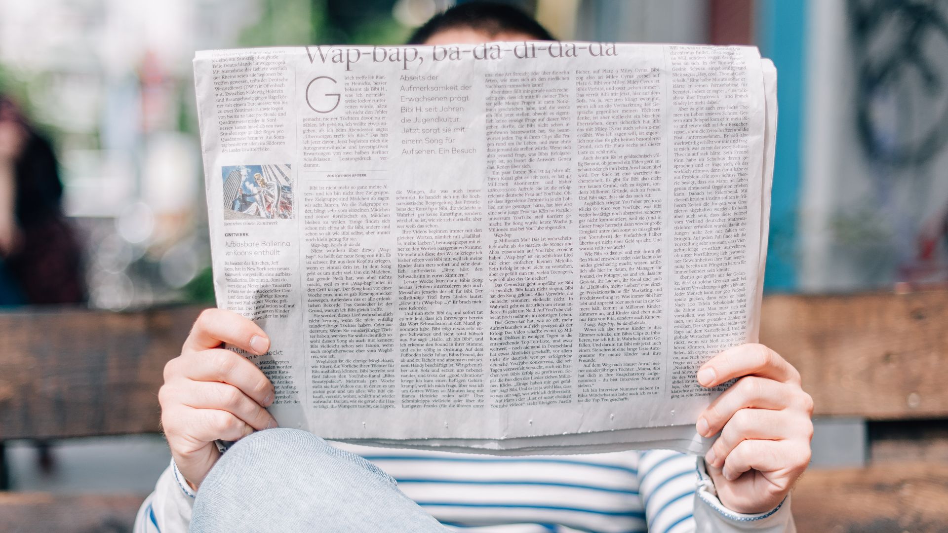 File:Person reading a newspaper (Unsplash).jpg