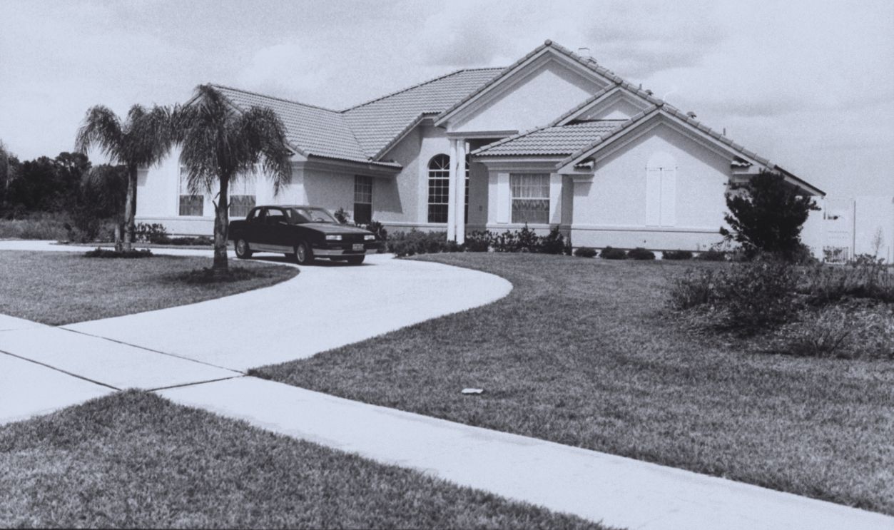 Gettyimages - 50420753, James Bakker [Misc.] [& Wife] View of front yard and house of disgraced PTL minister Jim Bakker and his wife Tammy Faye, w. mid-size sporty car in driveway.  