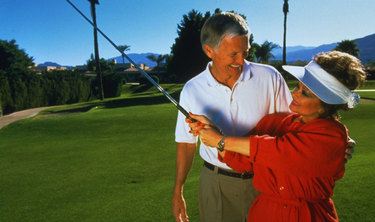 Gettyimages - 50478861, Tammy Faye Messner;Roe Messner [& Wife #2] Church developer Roe Messner w. arm around TV talk show host wife Tammy Faye Messner (formerly Baker) as she swings golf club nr. their home. 