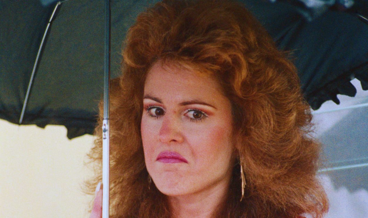 Gettyimages - 515363564, Scandal Witness Jessica Hahn Carrying an Umbrella (Original Caption) West Babylon, New York: Jessica Hahn, the church secretary whose brief alligiance with PTL Minister Jim Bakker in a Florida Hotel seven years ago led to his downfall, meets the press outside her home 4/28. 