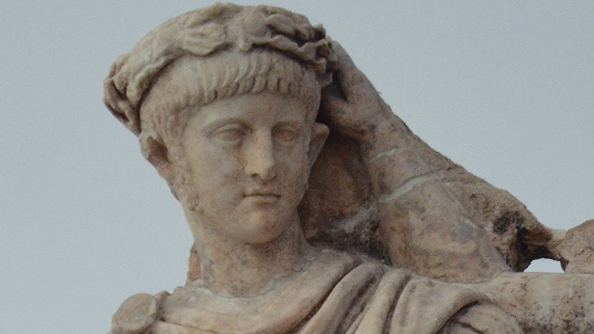 Agrippina crowns her young son Nero with a laurel wreath. She carries a cornucopia, symbol of Fortune and Plenty. Nero wears the armour and cloak of a Roman commander, with a helmet on the ground at his feet. The scene refers to Nero's accession as empero