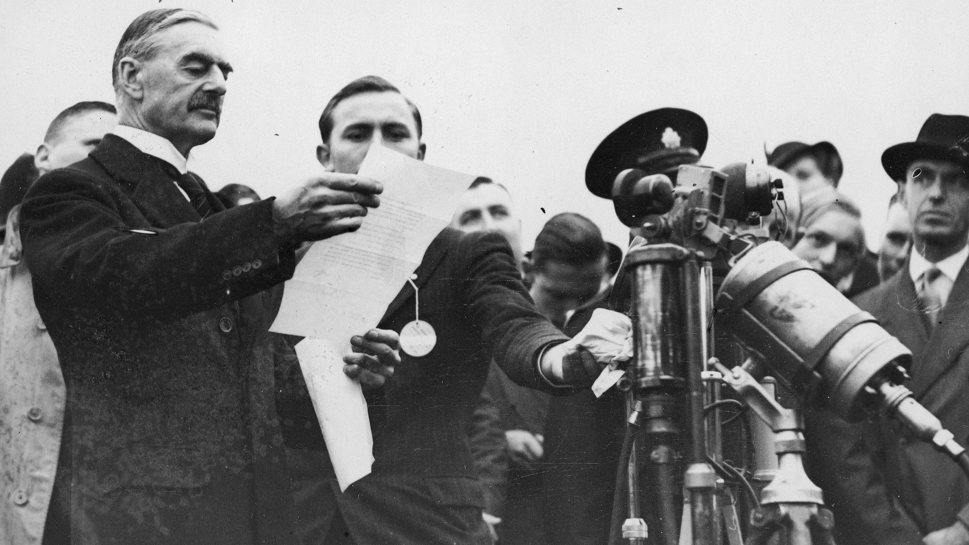 Munich Agreement, Chamberlain: Peace for our time.
The British Prime Minister Neville Chamberlain commenting and showing the Anglo-German Declaration (the resolution) of the Munich Agreement (German: Münchener Abkommen) to commit to peaceful methods sign