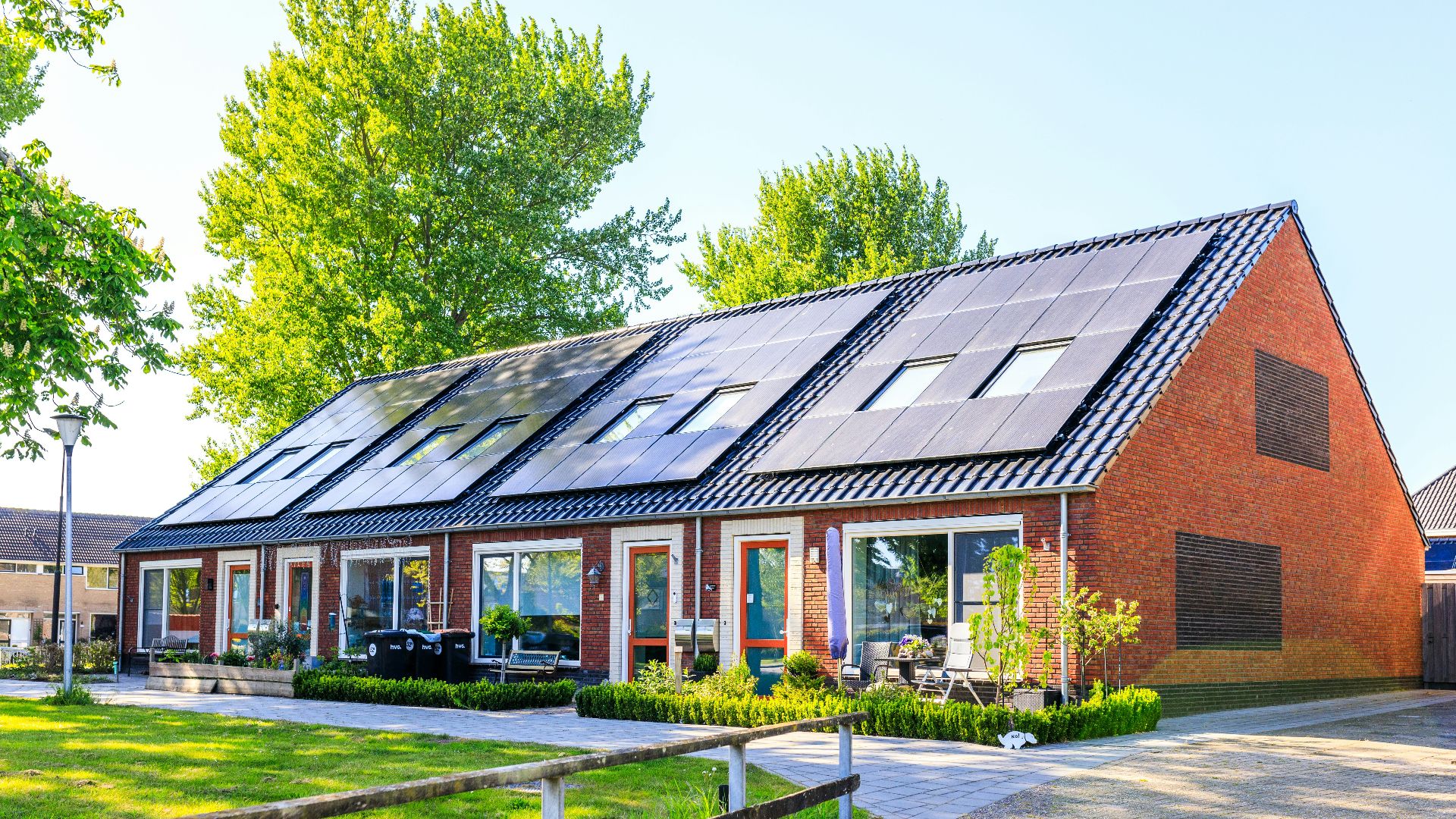 A house with a lot of solar panels on the roof