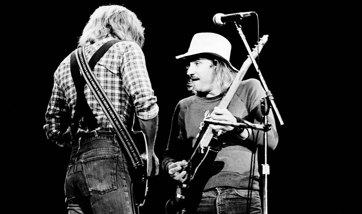 Don Felder and Joe Walsh of The Eagles perform on stage at the Wembley Arena, London, England, on 26 April 1977. 