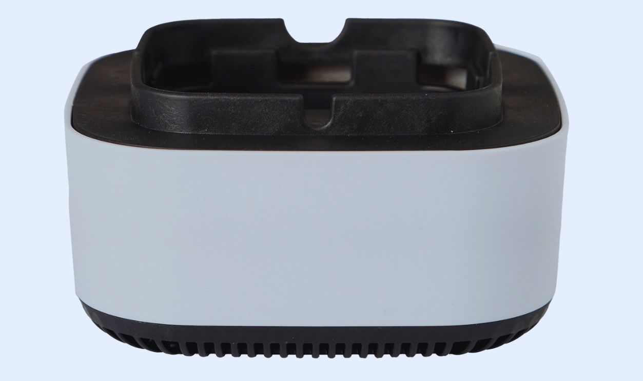 White and black smokeless ashtray, designed to reduce smoke and odor, isolated on a white background.