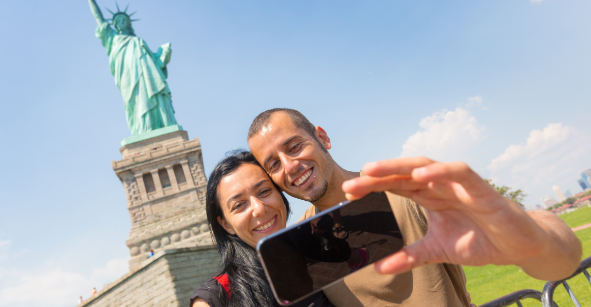 Couple Taking a Selfie with Statue of Liberty on Background