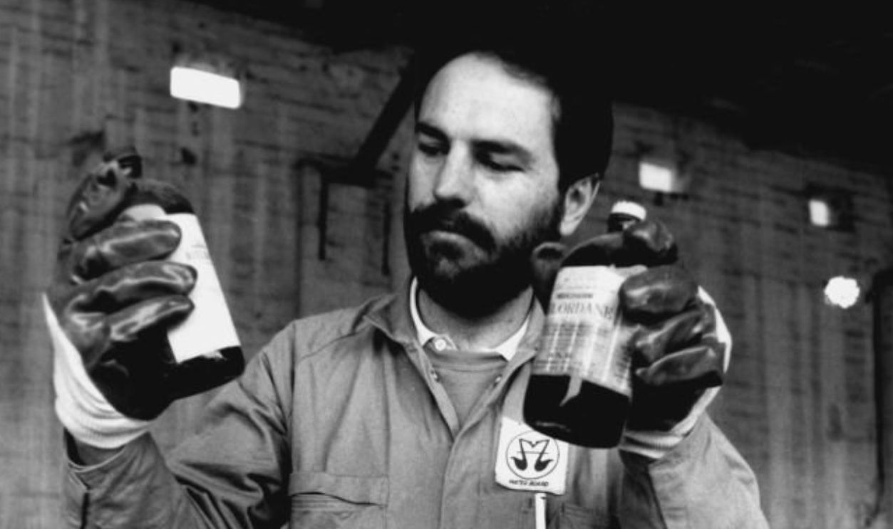 Poisonous Chemicals Collection - Steve Murphy, Water Board trade waste officer with so far most dangerous chemicals Chlordane and Dieldrin chemicals 20 year old at Waverley depot. July 22, 1989. 