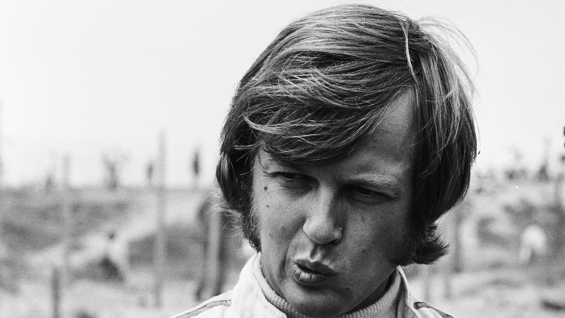 Ronnie Peterson talks with his Antique Automobiles team boss, Colin Crabbe, at the 1970 Dutch Grand Prix.