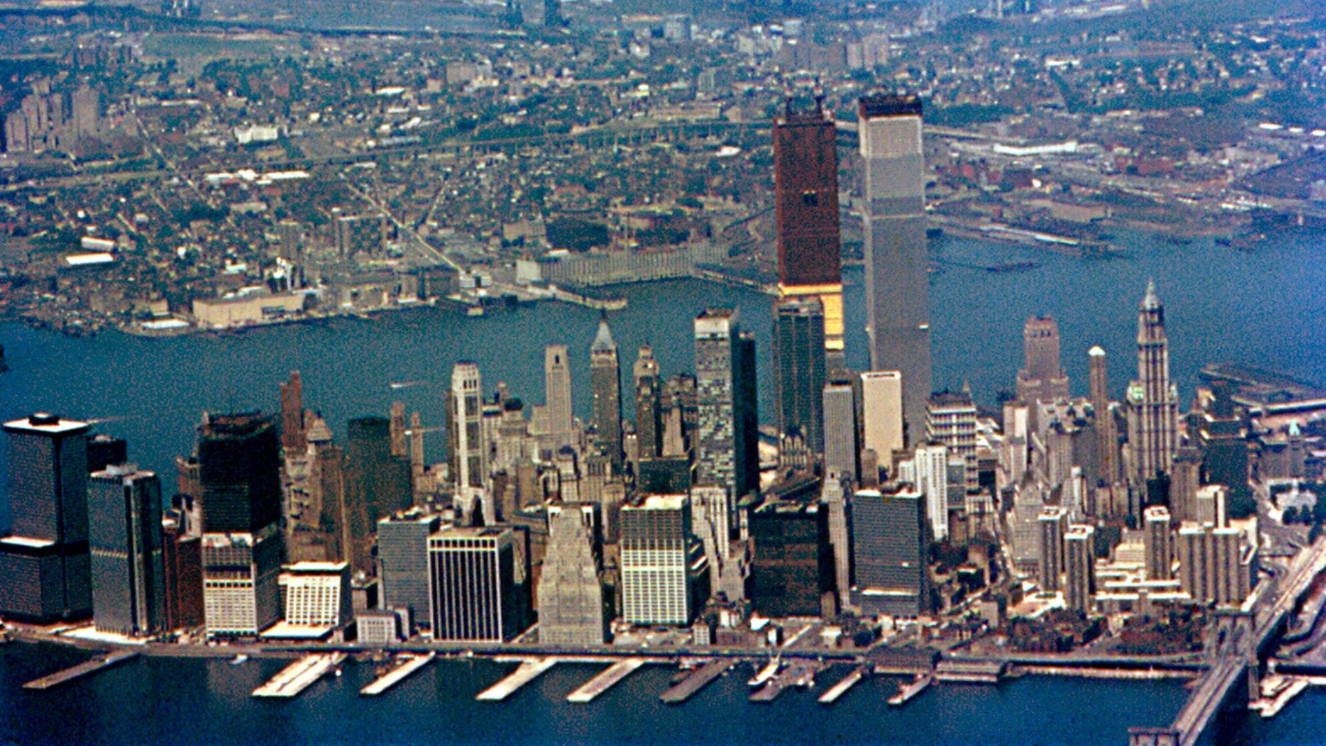 Lower Manhattan, from an airplane approaching LaGuardia Airport in July 1971. East River is in the foreground. Hudson River and New Jersey are in the background.
I read somewhere that the World Trade Center was completed in July 1971, but it looks lik