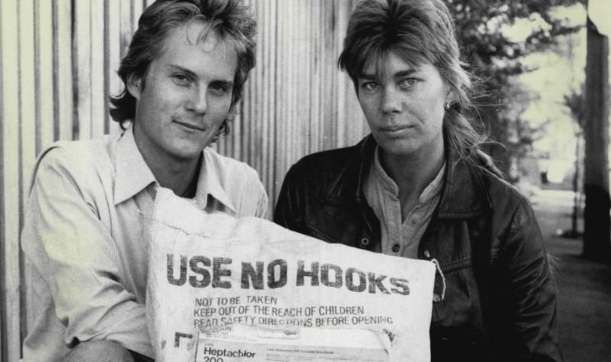 Robert Verkerk and Dr. Kate Short with a bag of banned pesticide Heptachlor.Recently purchase at Paddy's Market. April 19, 1985.