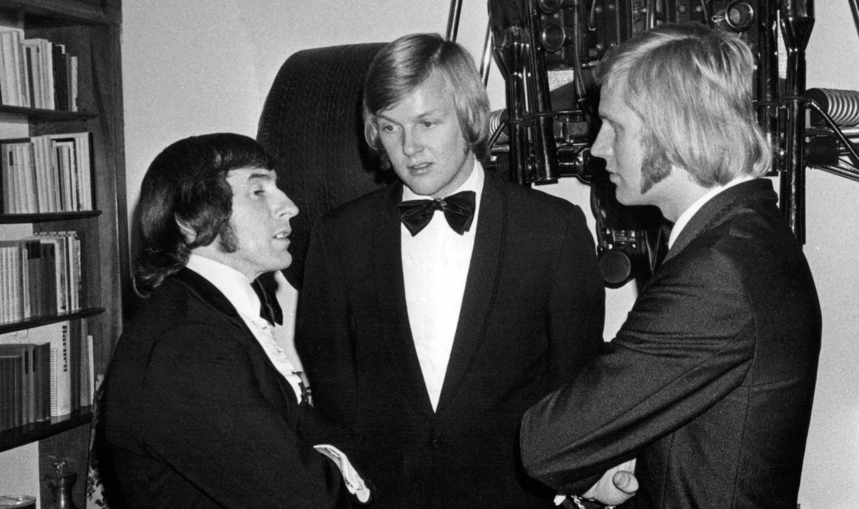 Jackie Stewart, Ronnie Peterson, Reine Wissel, Jo Bonnier's home, Le Muids, December 31, 1971. Jackie Stewart, Ronnie Peterson and Reine Wissel at a party in the home of fellow driver Jo Bonnier (who had one of his Formula One cars hanging on his wall).