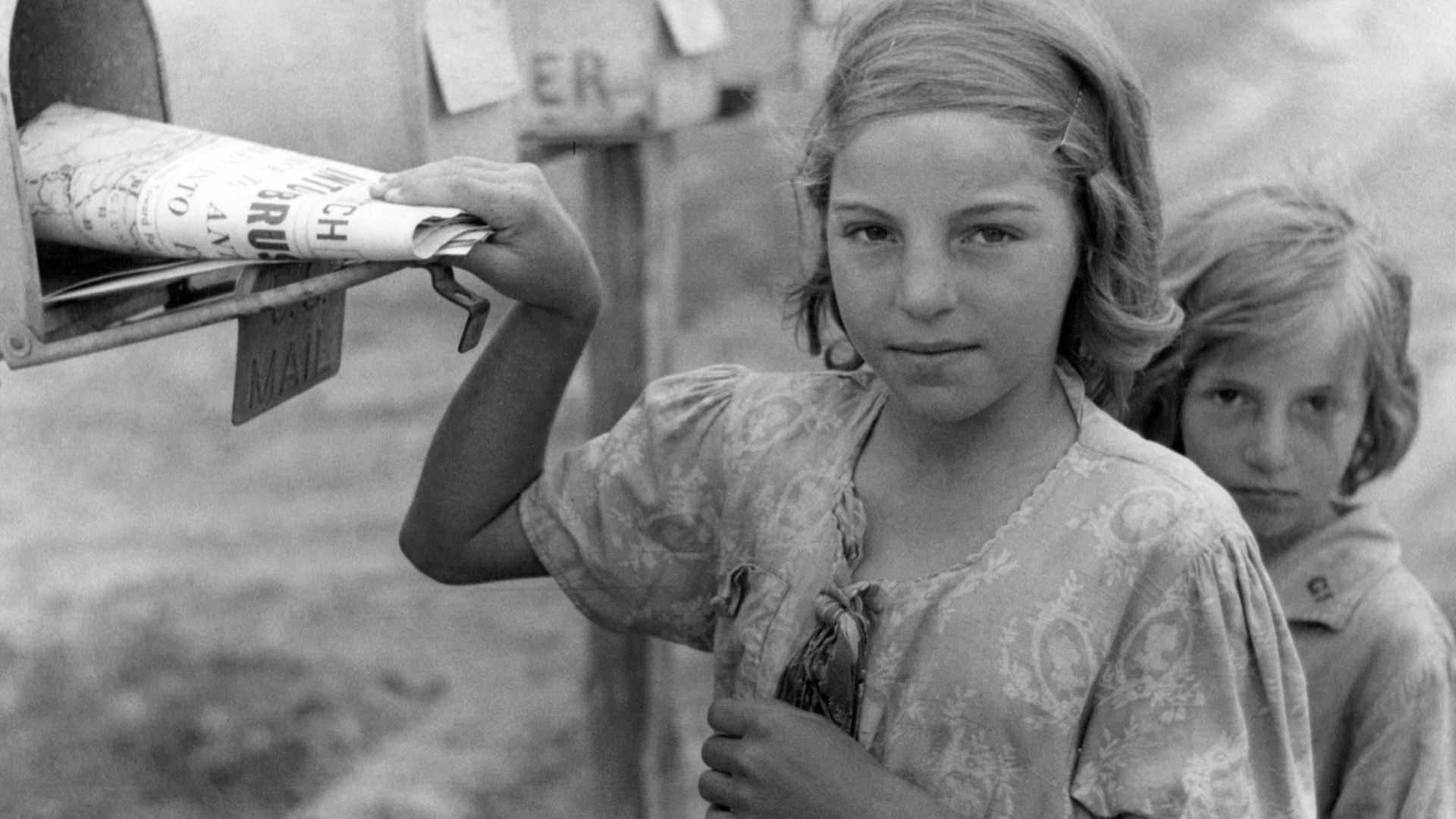 Ozark children getting mail from RFD box, Missouri.