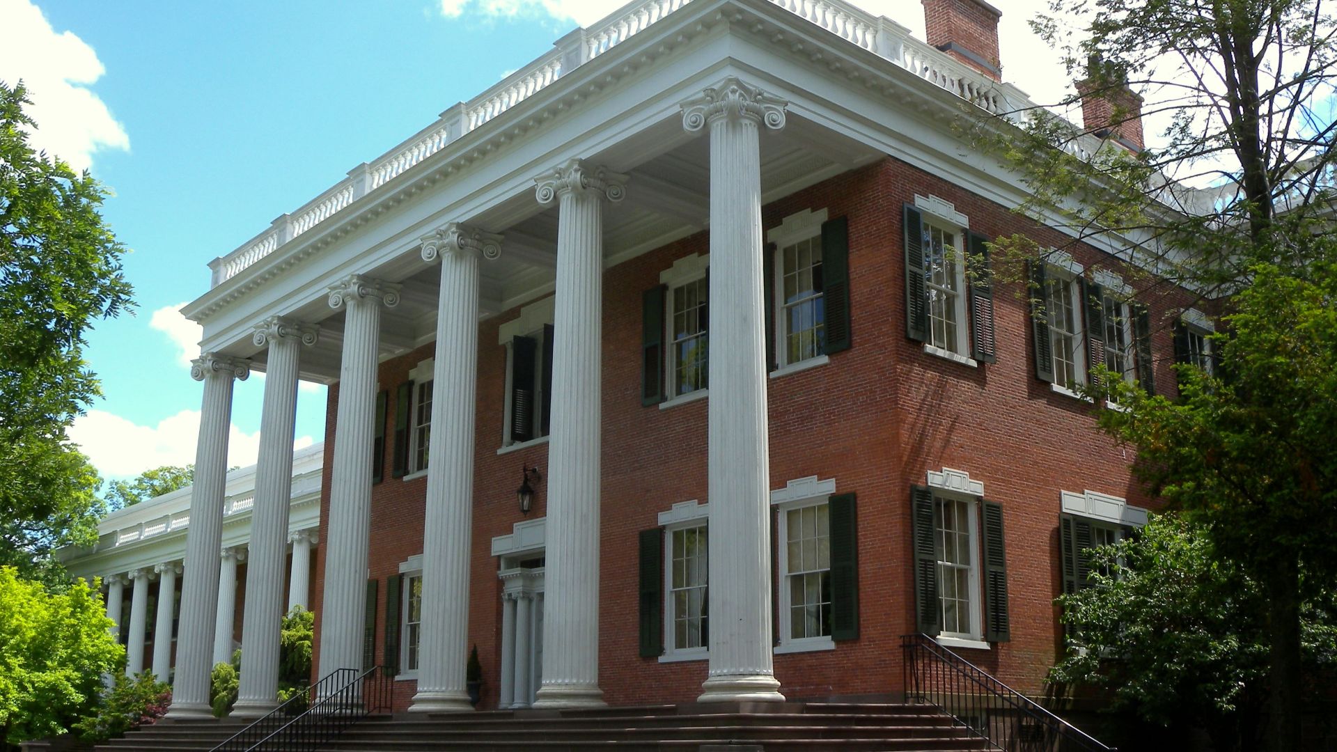 Looking south at Mead Hall, an 1836 Greek Revival house on the Drew University campus, New Jersey, on a mostly sunny early afternoon.  See also File:Mead Hall sign Drew U jeh.jpg.
