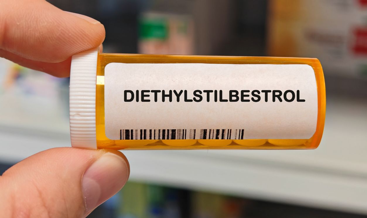 orange plastic Box of DIETHYLSTILBESTROL tablets on a hospital pharmacy table used as hormone therapy an estrogen analog. PHARMACY warehouse
