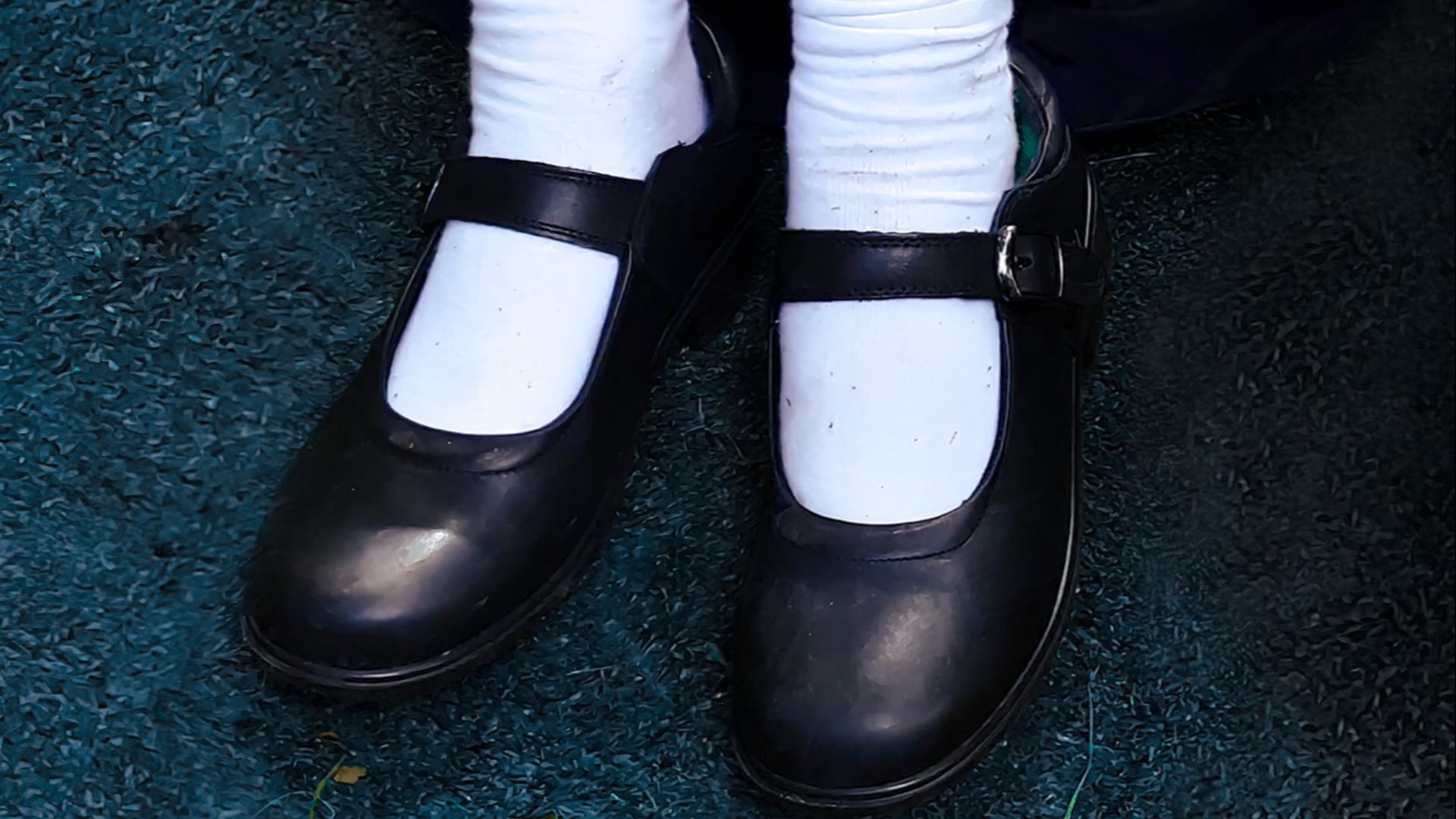 Mary Jane school shoes worn with socks. Usually worn by primary school-aged girls, even in the 21st Century.