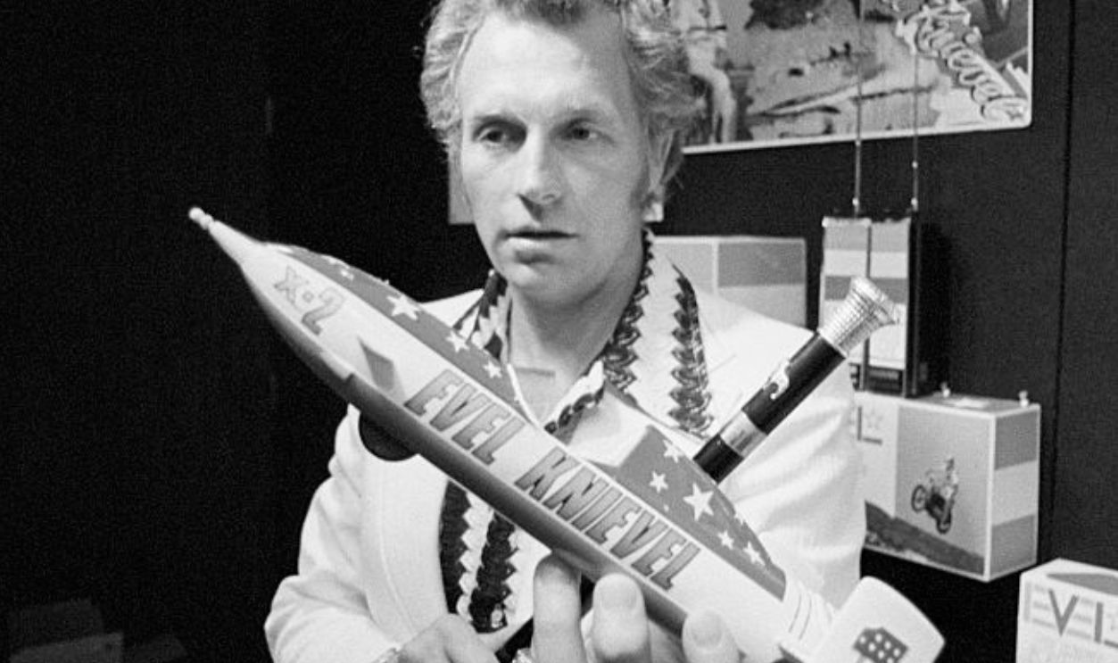 Evel Knievel Displaying a Model