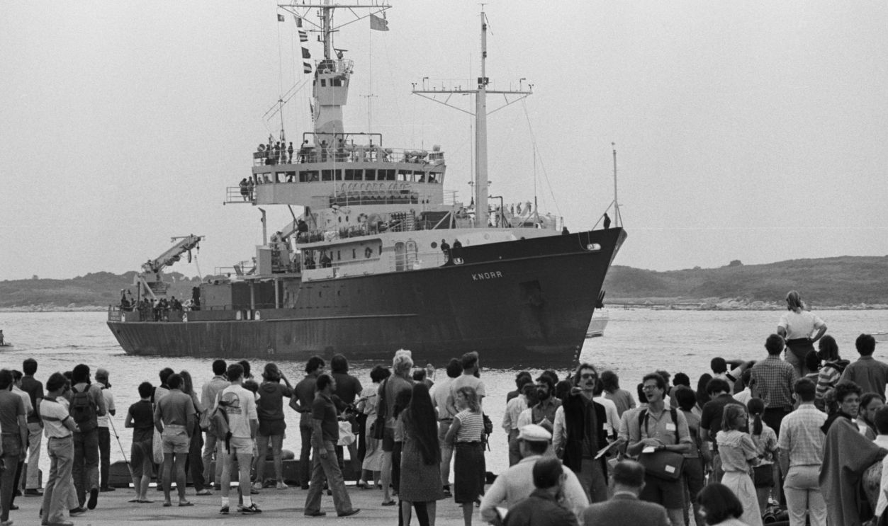Crowd Gazing at Research Vessel Knorr near Shore