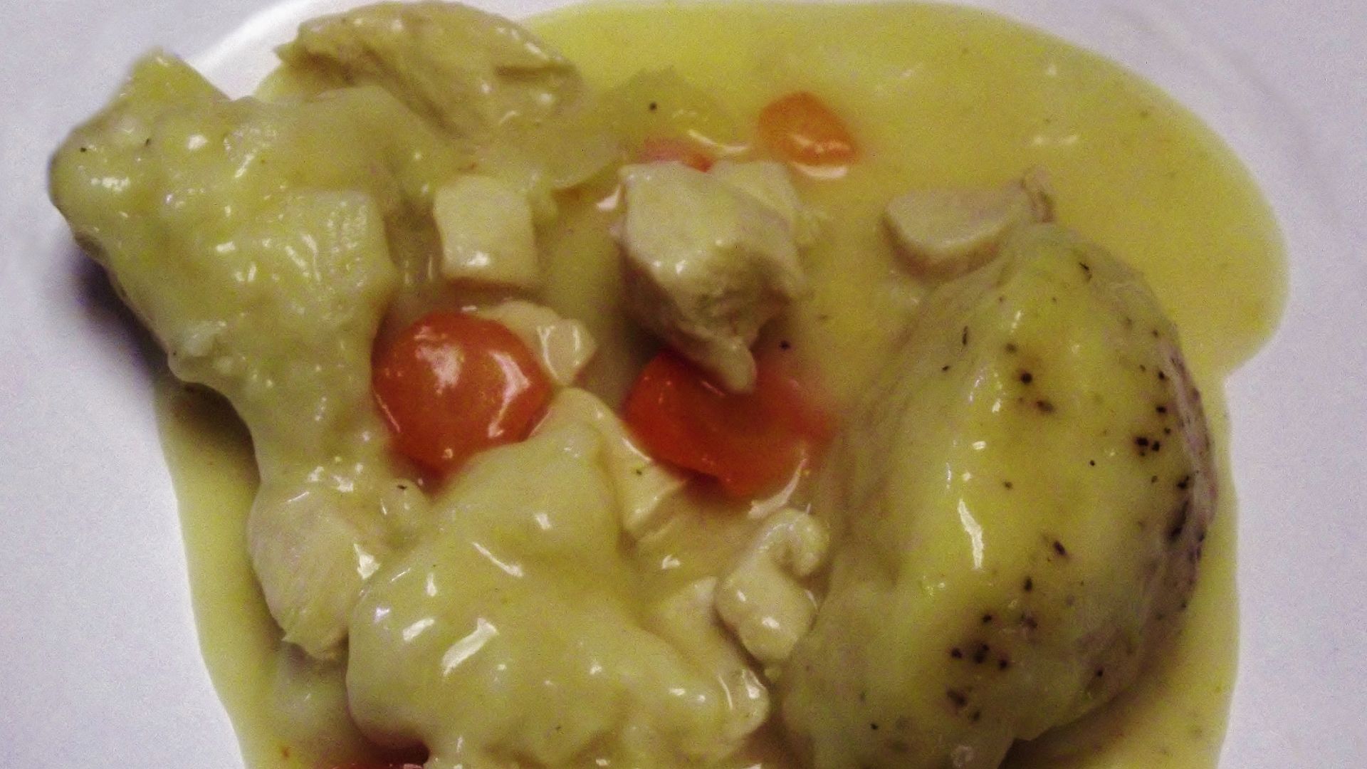 Traditional chicken and dumplings with vegetables.