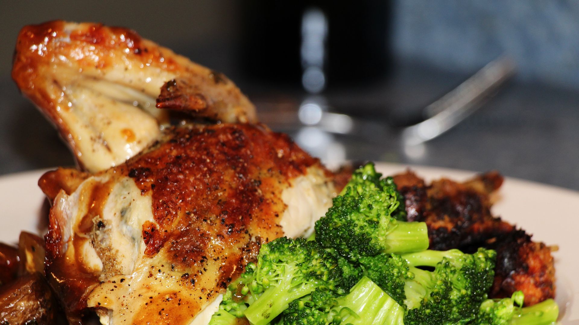 Roasted Chicken Dinner Plate, Broccoli, Stuffing, Potatoes, Demi Glace. Photo taken in Toronto, Ontario, Canada.