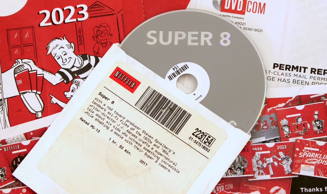 Fairfax, Virginia, United States - September 8 2023: Iconic red Netflix mailer and disc are shown in the final days of the DVD by mail service.