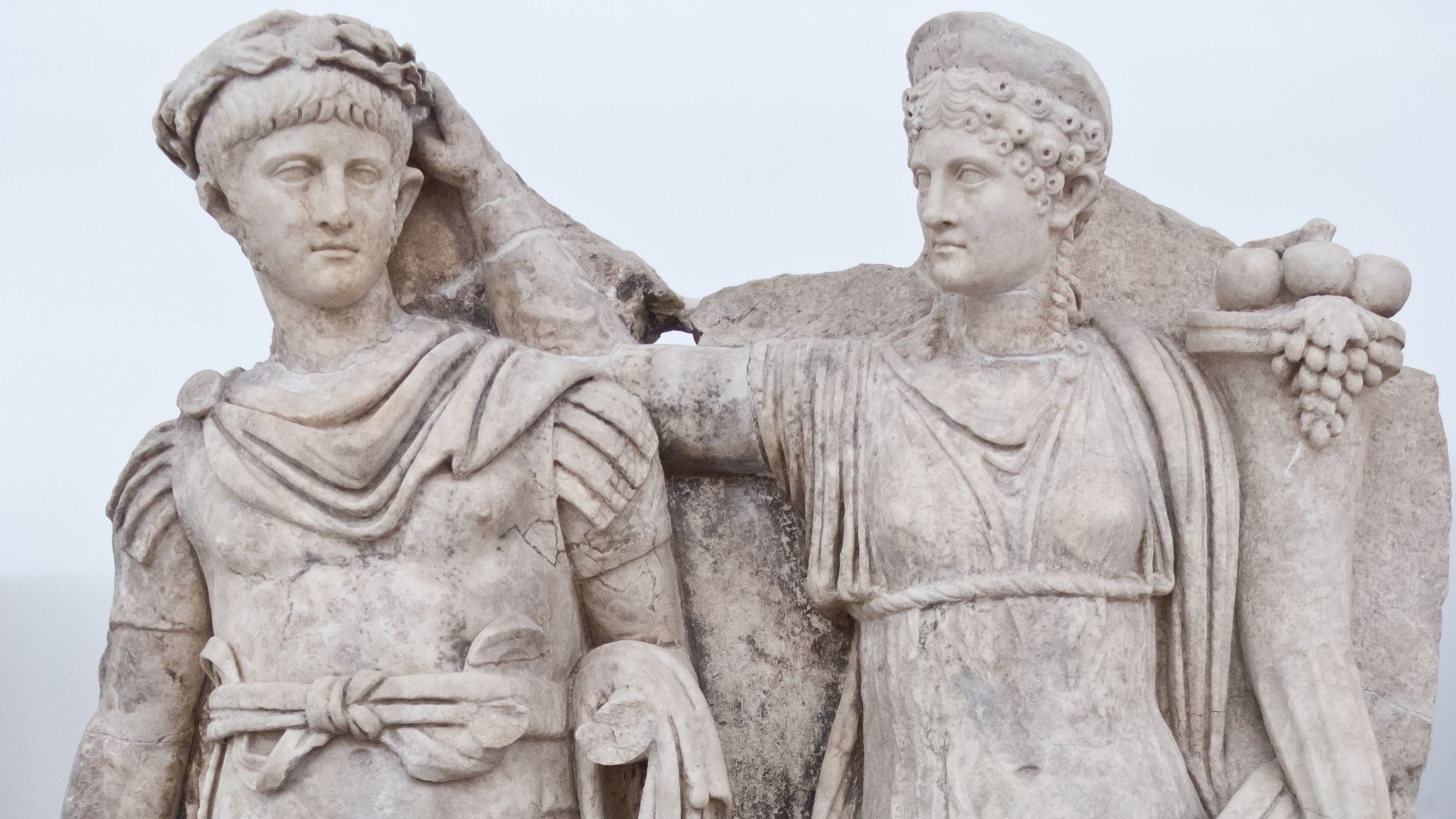 Nero and Agrippina. Agrippina crowns her young son Nero with a laurel wreath. She carries a cornucopia, symbol of fortune and plenty, and he wears the armour and cloak of a Roman commander, with a helmet on the ground at his feet. The scene refers to Nero