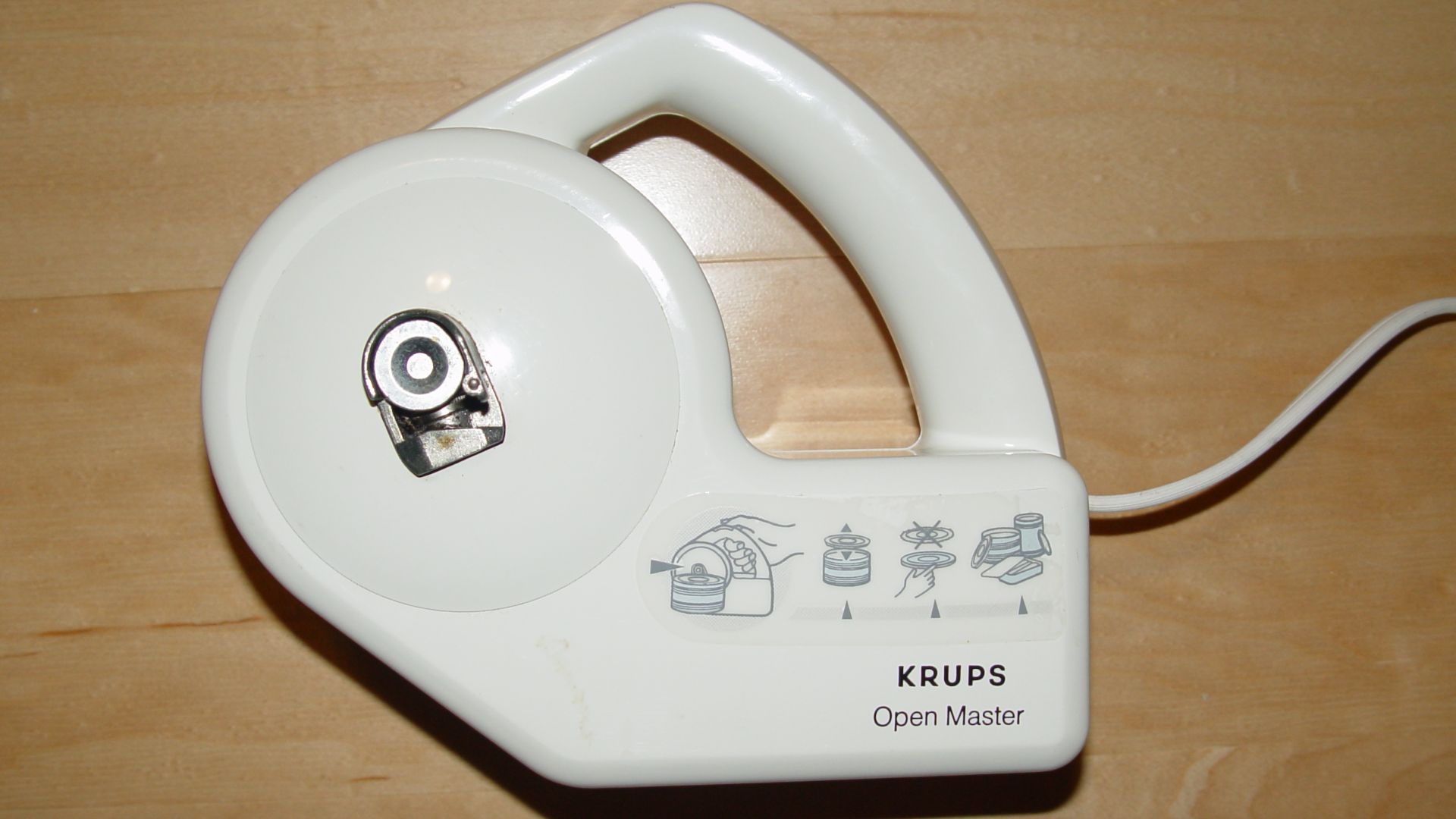 A Krups hand-held electric can opener.