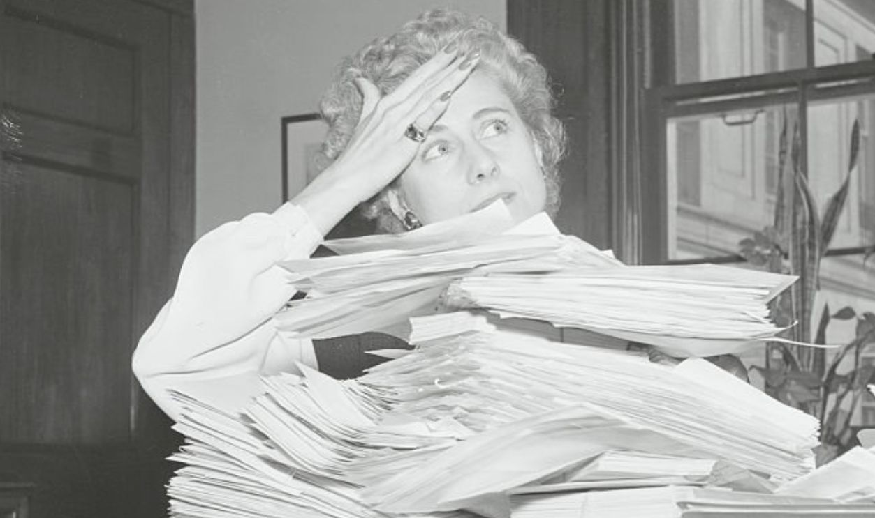 (Original Caption) Washington, D. C.: Luce Has Nylon Headaches. Rep. Clare Boothe Luce, of Conn., has more than the usual amount of worries as she goes through this huge pile of letters, sent to her by thousands of women all over the U. S., all wanting to know when the current nylon shortage would end, and all appealing to her for aid.
