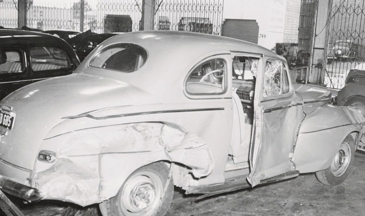 (Original Caption) This is the car in which Anne Clare Boothe, daughter of congresswoman Clare Booth Luce. Was riding when she met death. This car was involved in a collision with another automobile, and Miss Brokaw was involved in a collision with another automobile, and Miss Brokaw was hurled through the door and into the street, dying almost instantly. Mrs. Luce, in nearby San Francisco for a speaking engagement. Rushed to her daughter's side, but too late to see her before she died. The girl friend who was driving was not seriously injured in the crash.