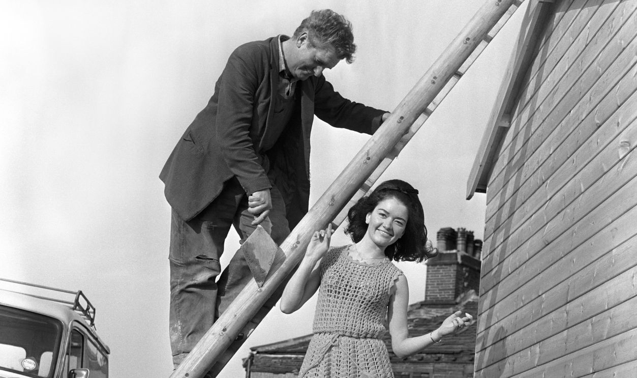 Getty Images - 808127862 - After a lifetime - twenty-two years - of not walking under ladders and throwing salt over her shoulder, pretty girl singer Brenda Hudson is keeping her fingers crossed today, because Decca are releasing her first record I shouldn't Care About You Will Friday the Thirteenth be a lucky day for Brenda?
