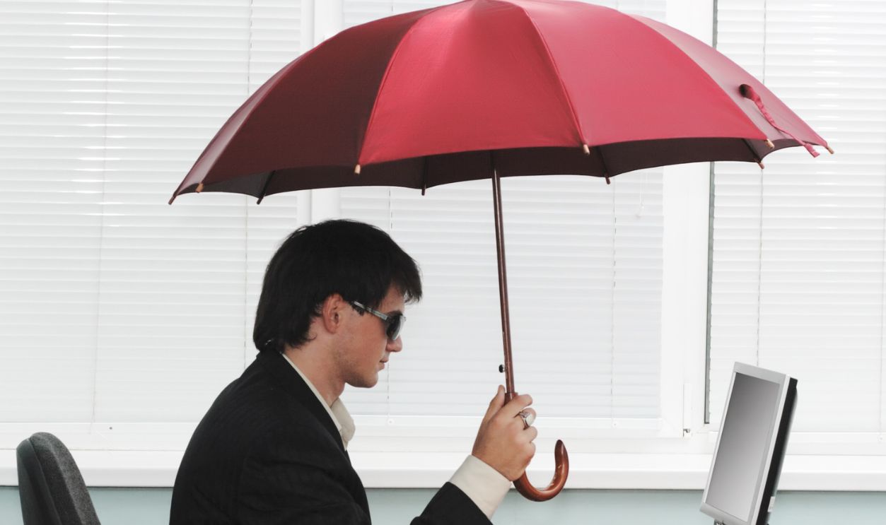 Shutterstock - 14820541 - Man Using Umbrella Indoor.