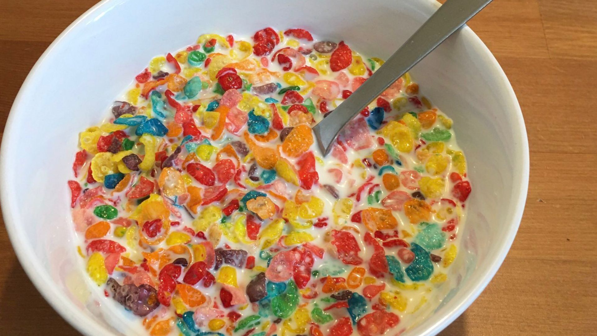 Fruity Pebbles cereal with milk (Sweetened Rice Cereal, Natural and Artificial Fruit Flavor)