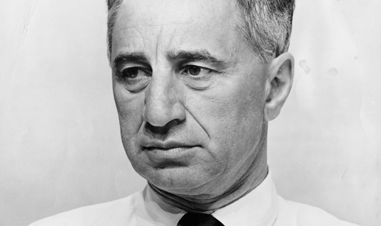 Portrait of film director Elia Kazan not looking to happy. Undated photograph from the John Springer collection.