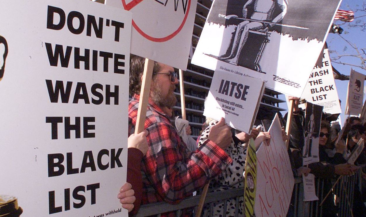 Protestors demonstrate 21 March 1999 in Los Angeles against the Lifetime Achievement Award to be presented to US film director Elia Kazan during the 71st Annual Academy Awards. The award to Kazan, who directed "On the Waterfront", has angered many stars who recall how he destroyed careers when he "named names" before the US House Un-American Activities Committee's infamous 1950's probe of communists in Hollywood.