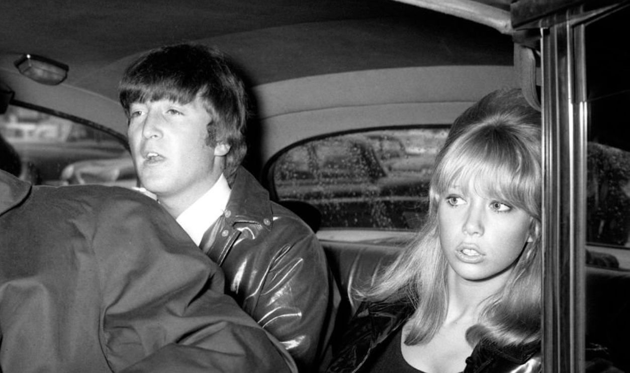 John Lennon with his wife Cynthia in the back of a car. 26th May 1964.
