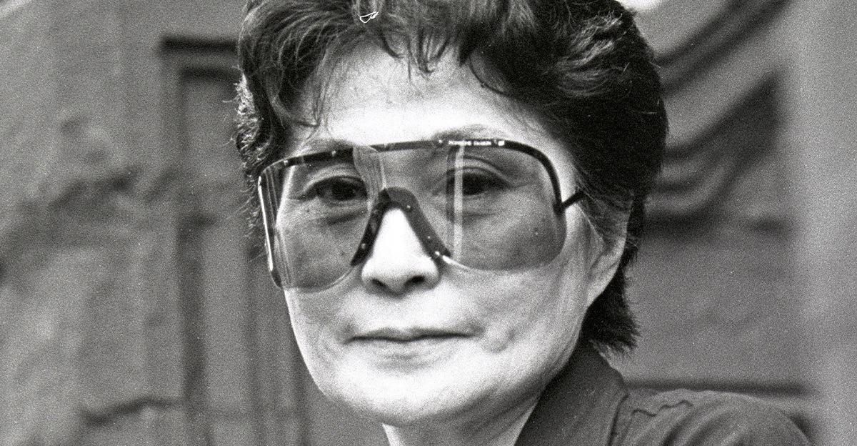 Yoko Ono on sits on a stoop in Manhattan on July 17, 1992.