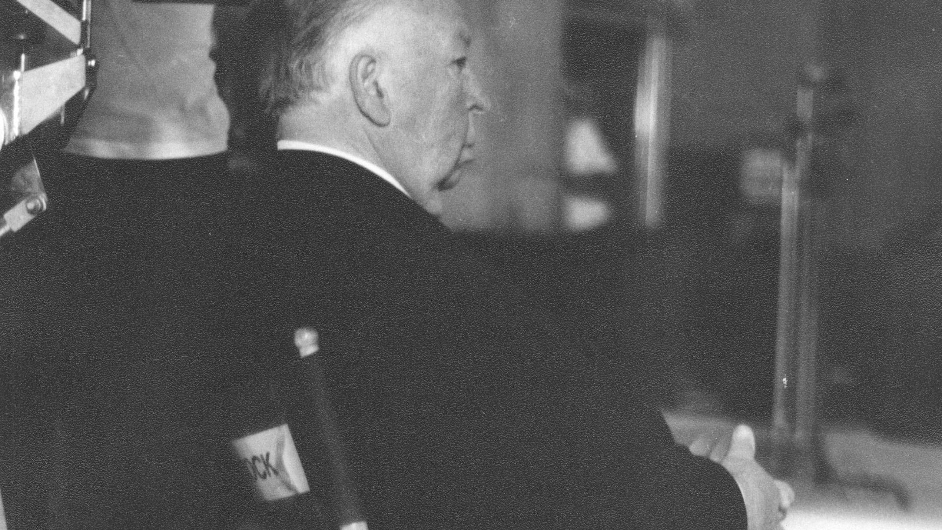Alfred Hitchcock directing Family Plot inside Grace Cathedral, San Francisco, California. This is a scan of an 8x10 B&W print made from a 35mm B&W negative. The picture was taken between takes without flash while holding the camera steady on top of the 1s