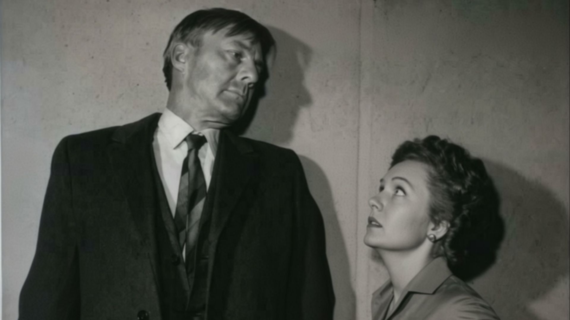 OUTWARD BOUND David Wayne stops to talk to his wife, played by Kathleen O'Malley, in the suspense drama